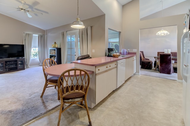 3892 SW Jablo St, Port Saint Lucie, FL 34953 - kitchen featuring vaulted ceiling, white dishwasher, decorative light fixtures, a chandelier, and open floor plan