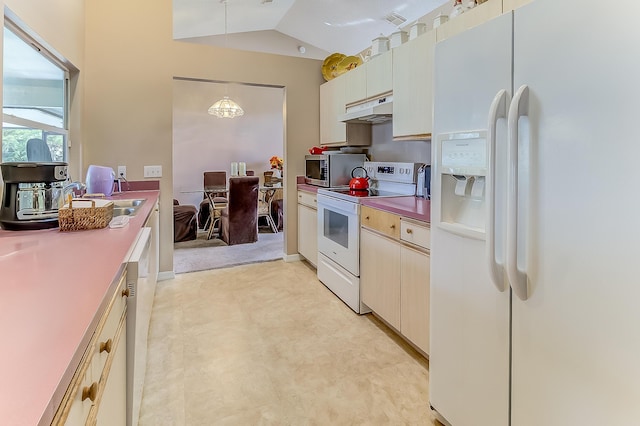 3892 SW Jablo St, Port Saint Lucie, FL 34953 - kitchen with white appliances, under cabinet range hood, lofted ceiling, pendant lighting, and a sink