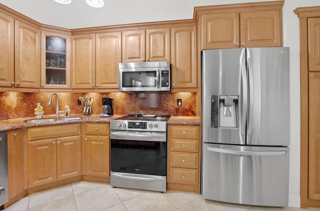 9844 Boca Gardens Cir N Unit D, Boca Raton, FL 33496 - kitchen with appliances with stainless steel finishes, a sink, light stone counters, and light tile patterned flooring