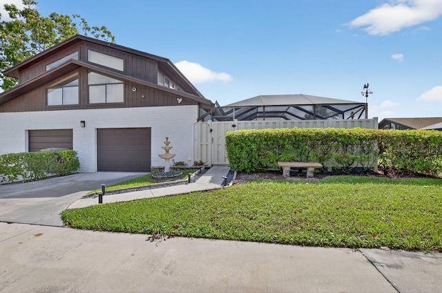 9844 Boca Gardens Cir N Unit D, Boca Raton, FL 33496 - view of front of home with brick siding, a front lawn, driveway, and a garage