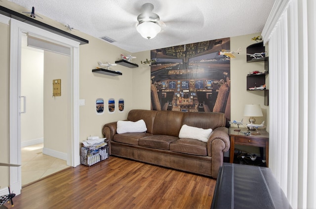 9844 Boca Gardens Cir N Unit D, Boca Raton, FL 33496 - living room with a textured ceiling, wood finished floors, ceiling fan, and baseboards
