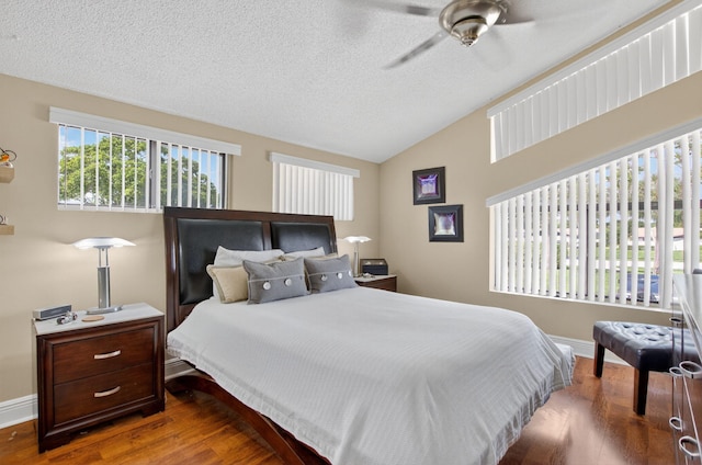 9844 Boca Gardens Cir N Unit D, Boca Raton, FL 33496 - bedroom with vaulted ceiling, wood finished floors, baseboards, a textured ceiling, and ceiling fan