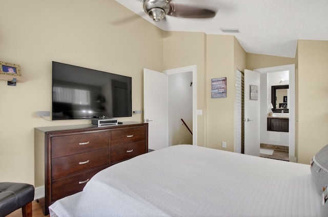 9844 Boca Gardens Cir N Unit D, Boca Raton, FL 33496 - bedroom with lofted ceiling, wood finished floors, ensuite bathroom, and a ceiling fan