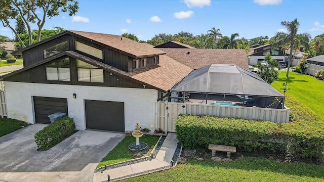 9844 Boca Gardens Cir N Unit D, Boca Raton, FL 33496 - view of front of home with brick siding, a garage, a front lawn, driveway, and a shingled roof