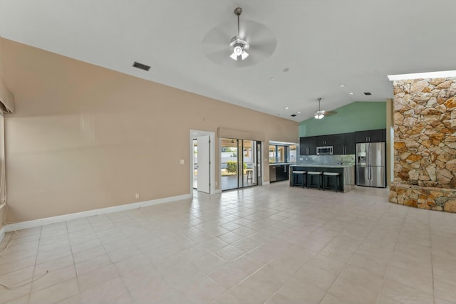 11038 Monet Ln, Palm Beach Gardens, FL 33410 - unfurnished living room featuring a ceiling fan, light tile patterned flooring, and high vaulted ceiling