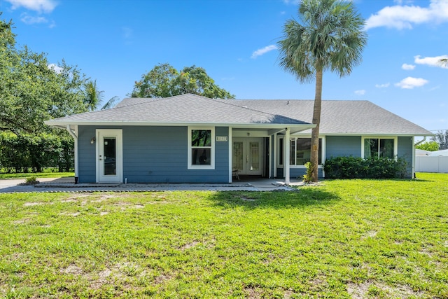 11038 Monet Ln, Palm Beach Gardens, FL 33410 - view of front of house with french doors and a shingled roof