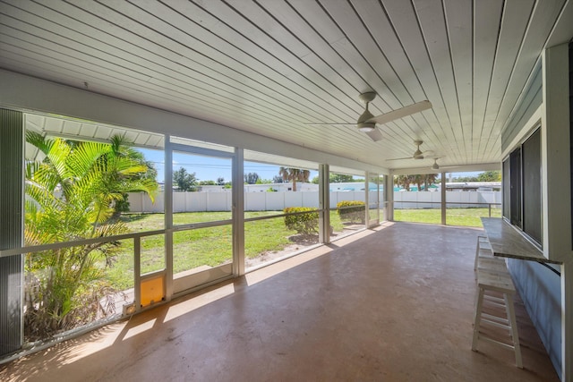 11038 Monet Ln, Palm Beach Gardens, FL 33410 - unfurnished sunroom with ceiling fan and a water view
