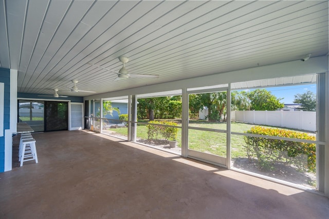 11038 Monet Ln, Palm Beach Gardens, FL 33410 - unfurnished sunroom with ceiling fan and plenty of natural light