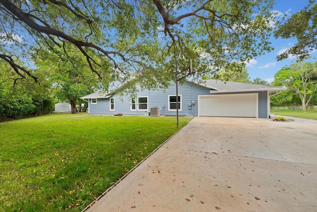 11038 Monet Ln, Palm Beach Gardens, FL 33410 - view of front of home featuring driveway, a front yard, and an attached garage