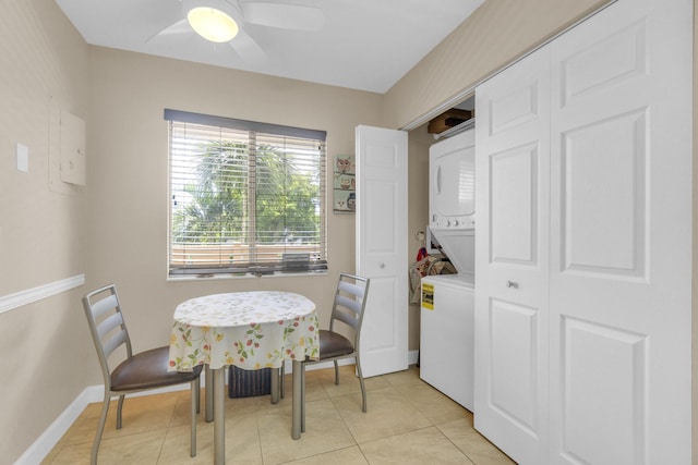 14375 Strathmore Ln Unit 306, Delray Beach, FL 33446 - dining space with stacked washing machine and dryer, ceiling fan, and light tile patterned floors