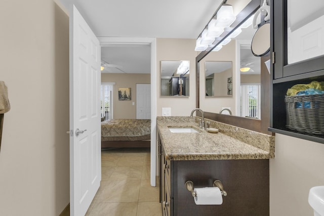 14375 Strathmore Ln Unit 306, Delray Beach, FL 33446 - ensuite bathroom with vanity, tile patterned flooring, and ceiling fan