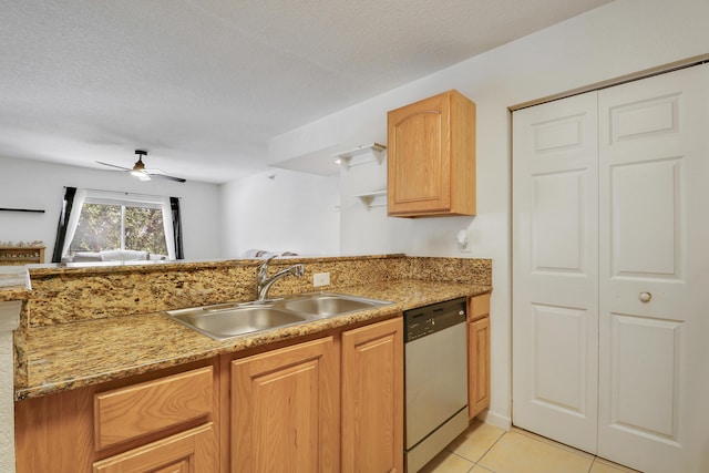 261 SW Palm Dr Unit 205, Port Saint Lucie, FL 34986 - kitchen with dishwasher, a sink, a ceiling fan, a peninsula, and light tile patterned floors