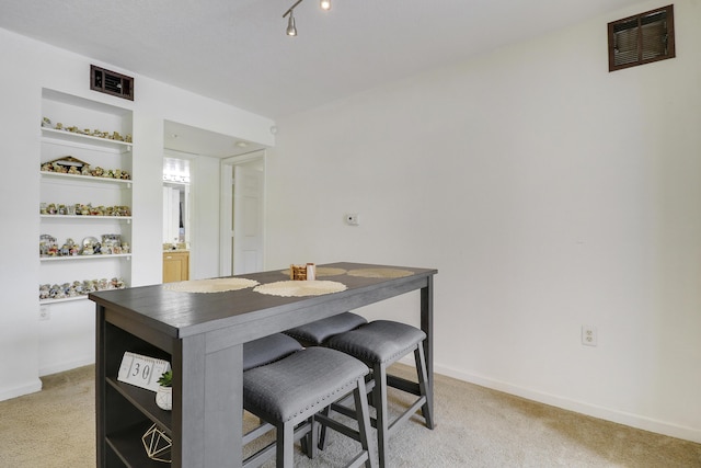 261 SW Palm Dr Unit 205, Port Saint Lucie, FL 34986 - dining room with light carpet and baseboards