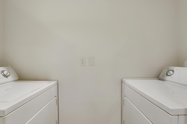 261 SW Palm Dr Unit 205, Port Saint Lucie, FL 34986 - laundry room featuring separate washer and dryer