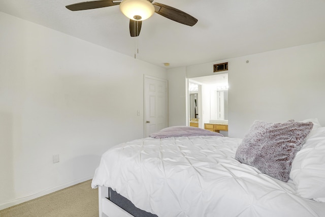 261 SW Palm Dr Unit 205, Port Saint Lucie, FL 34986 - bedroom featuring light carpet, baseboards, and a ceiling fan