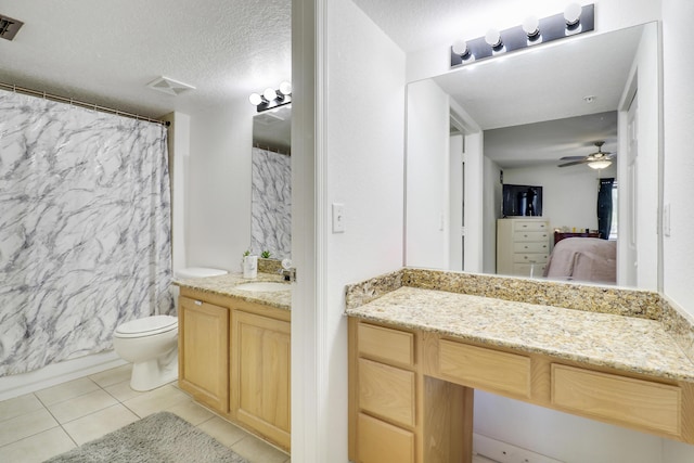 261 SW Palm Dr Unit 205, Port Saint Lucie, FL 34986 - ensuite bathroom featuring vanity, tile patterned flooring, ceiling fan, toilet, and a shower with shower curtain