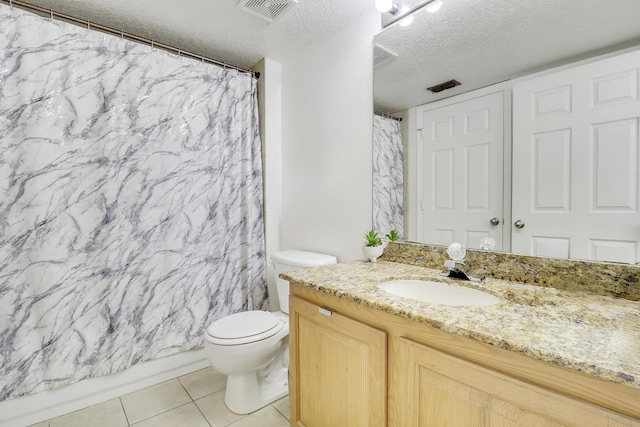 261 SW Palm Dr Unit 205, Port Saint Lucie, FL 34986 - full bath with vanity, toilet, tile patterned flooring, a textured ceiling, and a shower with curtain