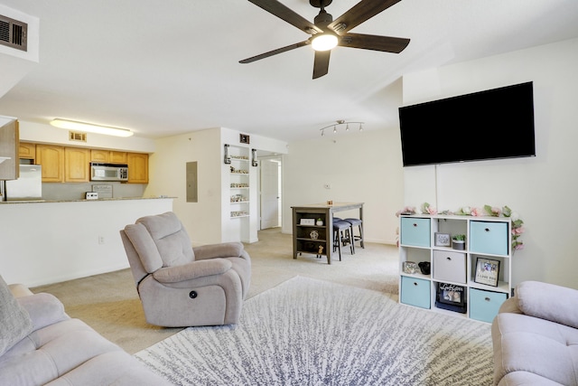 261 SW Palm Dr Unit 205, Port Saint Lucie, FL 34986 - living area with light colored carpet, ceiling fan, and electric panel