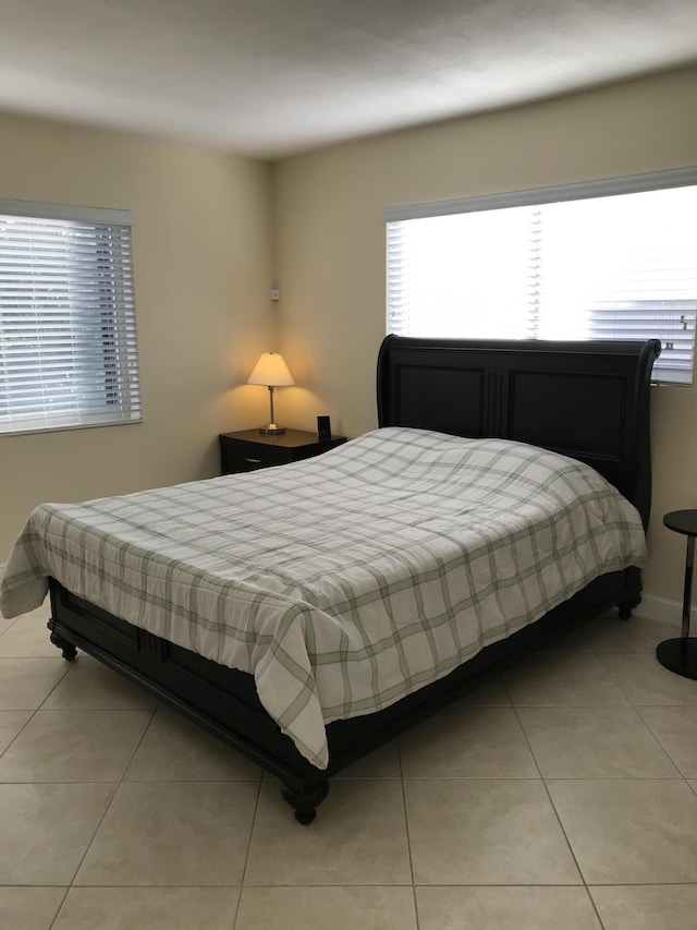 300 E Royal Palm Rd Unit 42B, Boca Raton, FL 33432 - bedroom featuring light tile patterned floors and baseboards