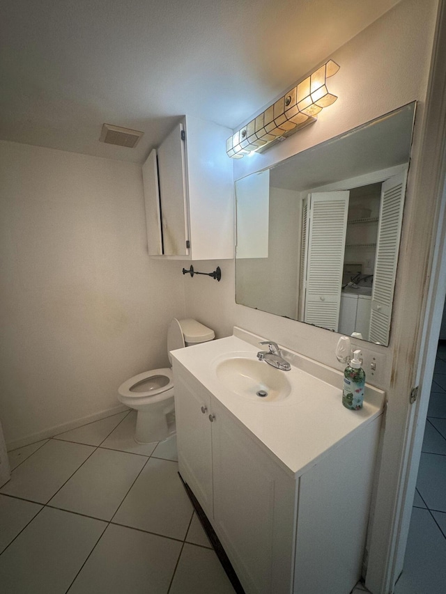 4348 Hazel Ave Unit B, Palm Beach Gardens, FL 33410 - bathroom with vanity, toilet, tile patterned floors, and baseboards