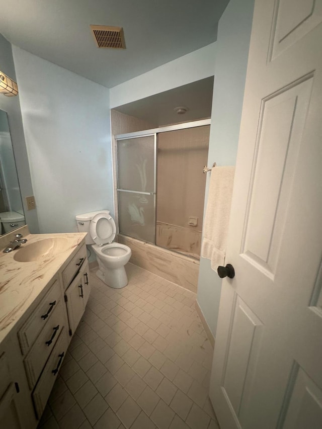 4348 Hazel Ave Unit B, Palm Beach Gardens, FL 33410 - full bath featuring vanity, shower / bath combination with glass door, toilet, and tile patterned flooring