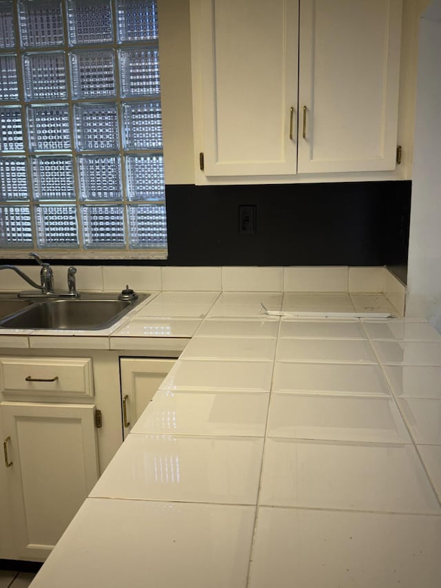 4348 Hazel Ave Unit B, Palm Beach Gardens, FL 33410 - kitchen with a sink, white cabinetry, and light countertops