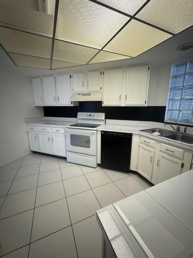 4348 Hazel Ave Unit B, Palm Beach Gardens, FL 33410 - kitchen featuring white electric range oven, dishwasher, a sink, a paneled ceiling, and under cabinet range hood