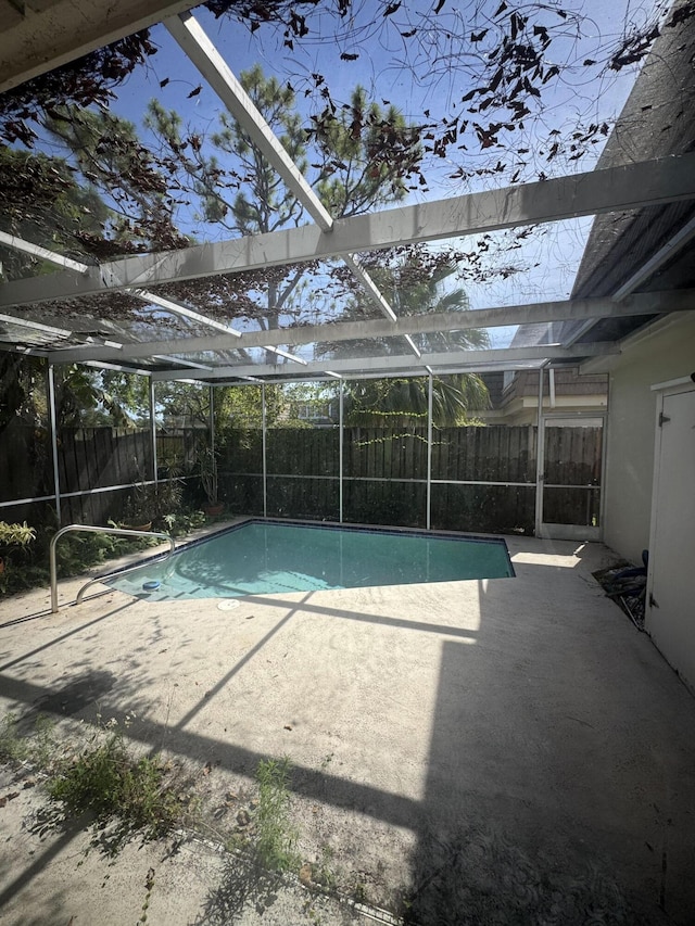 4348 Hazel Ave Unit B, Palm Beach Gardens, FL 33410 - view of swimming pool featuring a fenced backyard, glass enclosure, and a patio area