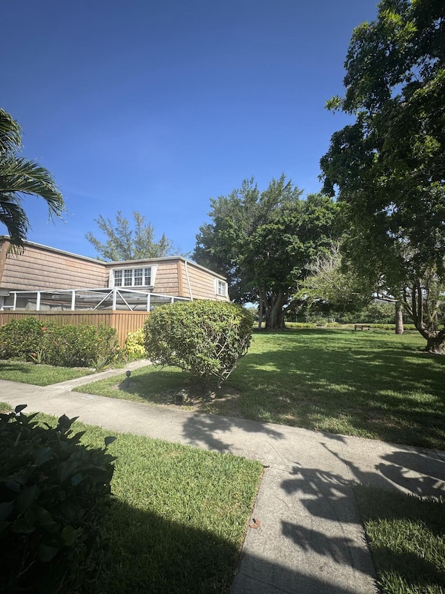 4348 Hazel Ave Unit B, Palm Beach Gardens, FL 33410 - view of grassy yard featuring a deck