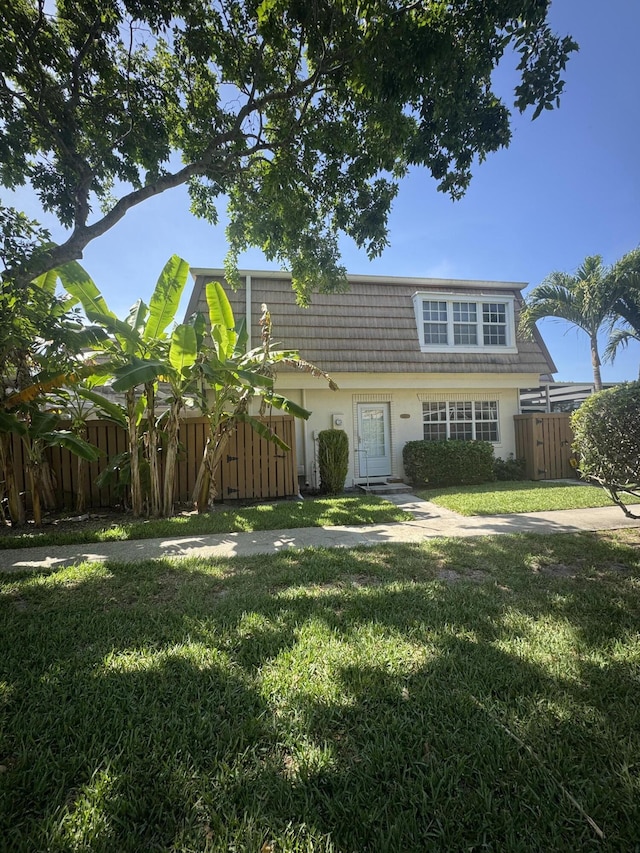 4348 Hazel Ave Unit B, Palm Beach Gardens, FL 33410 - view of front facade with mansard roof and stucco siding