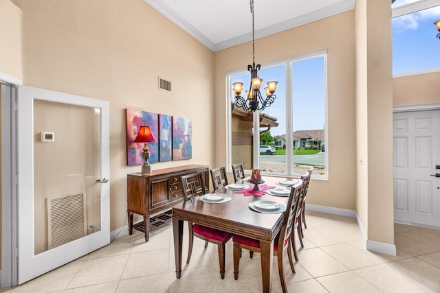 9556 E Lake Dr, Boca Raton, FL 33434 - dining space featuring ornamental molding, a chandelier, and light tile patterned flooring