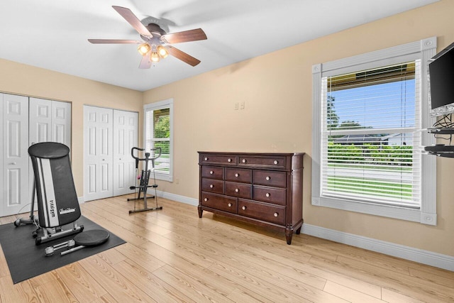 9556 E Lake Dr, Boca Raton, FL 33434 - workout room with ceiling fan and wood finished floors