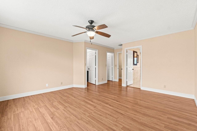 9556 E Lake Dr, Boca Raton, FL 33434 - unfurnished room featuring ceiling fan, light wood-style floors, ornamental molding, and a textured ceiling