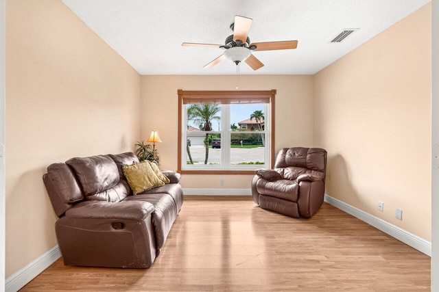 9556 E Lake Dr, Boca Raton, FL 33434 - living area with light wood-style floors and ceiling fan