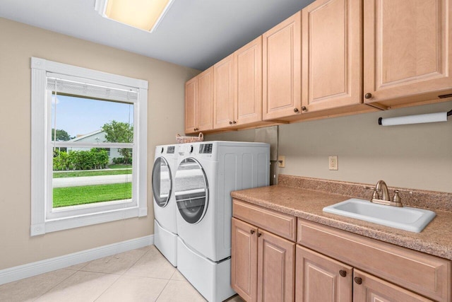9556 E Lake Dr, Boca Raton, FL 33434 - laundry room featuring washing machine and clothes dryer, cabinet space, and light tile patterned floors