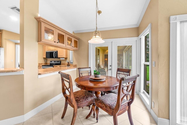 9556 E Lake Dr, Boca Raton, FL 33434 - dining space with french doors and light tile patterned floors