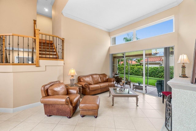 9556 E Lake Dr, Boca Raton, FL 33434 - living area featuring ornamental molding, stairs, a high ceiling, and tile patterned floors