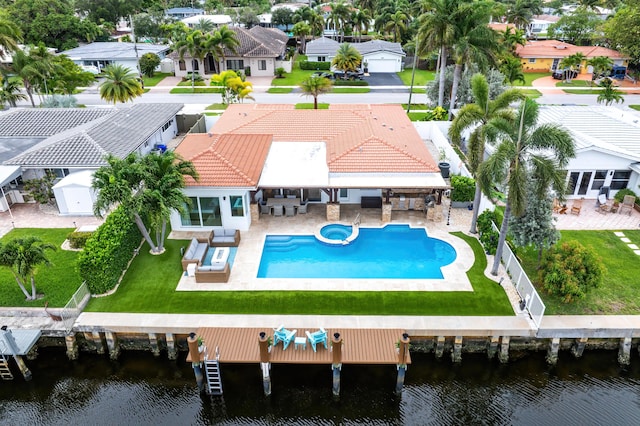 400 SE 5th Ter, Pompano Beach, FL 33060 - back of property featuring an outdoor hangout area, a water view, a residential view, a tile roof, and a patio area