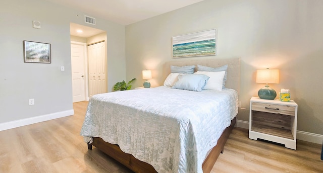 630 S Sapodilla Ave Unit 521, West Palm Beach, FL 33401 - bedroom featuring baseboards, wood finished floors, and a closet