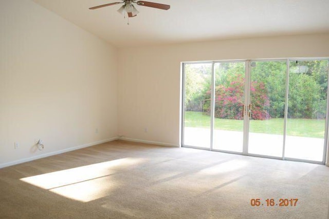 1701 SW Victor Ln SW, Port Saint Lucie, FL 34984 - spare room with carpet floors, a ceiling fan, baseboards, and lofted ceiling