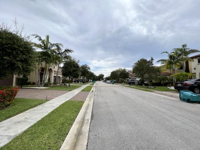 3841 E Aspen Leaf Dr, Boynton Beach, FL 33436 - view of asphalt road with sidewalks, curbs, and a residential view