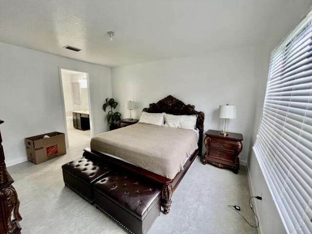 3841 E Aspen Leaf Dr, Boynton Beach, FL 33436 - bedroom featuring ensuite bath