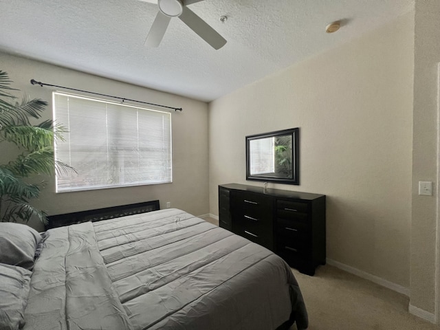 11021 Legacy Ln Unit 302, Palm Beach Gardens, FL 33410 - bedroom with light carpet, a textured ceiling, and a ceiling fan