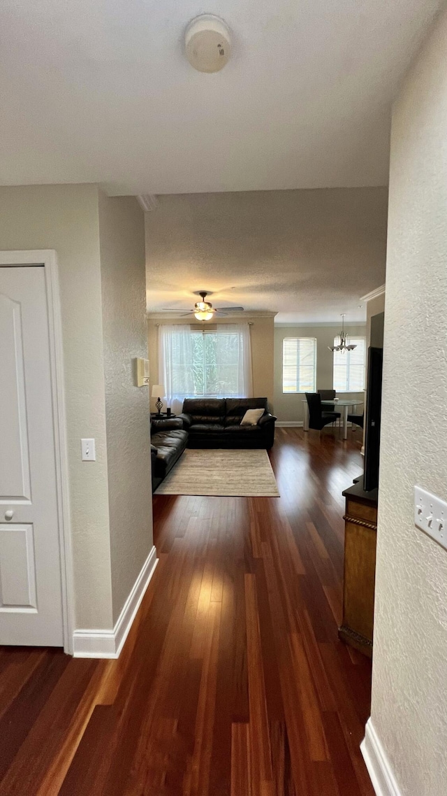 11021 Legacy Ln Unit 302, Palm Beach Gardens, FL 33410 - corridor with a textured wall, wood finished floors, and a chandelier