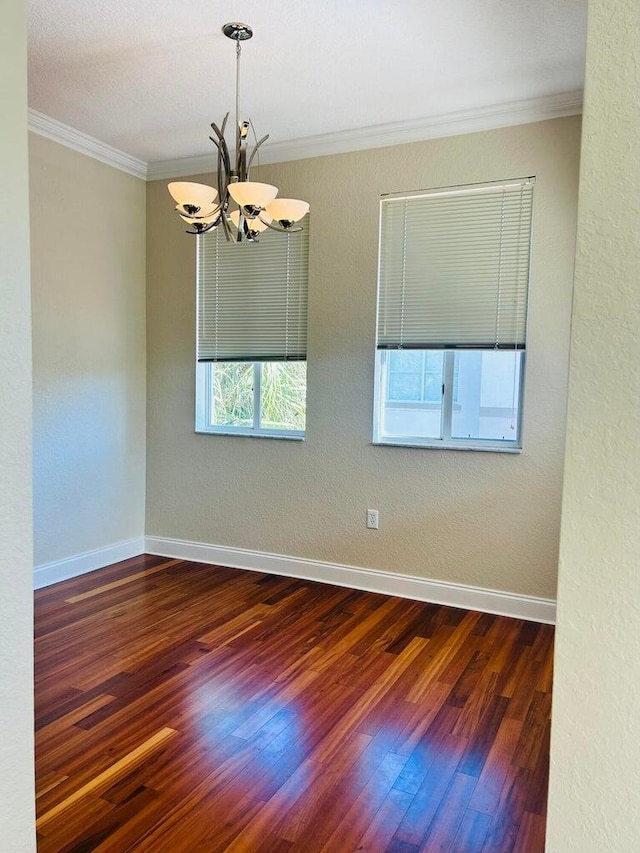 11021 Legacy Ln Unit 302, Palm Beach Gardens, FL 33410 - spare room with ornamental molding, dark wood-type flooring, and a chandelier