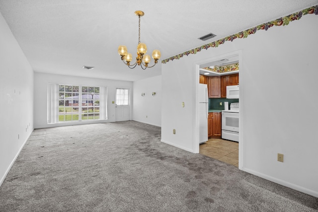 5557 S Shadyside Cir, West Palm Beach, FL 33415 - empty room featuring light colored carpet, a chandelier, and baseboards