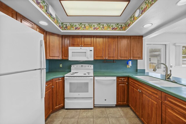 5557 S Shadyside Cir, West Palm Beach, FL 33415 - kitchen with white appliances, a sink, light tile patterned floors, and brown cabinetry