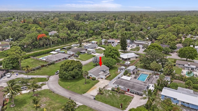 5557 S Shadyside Cir, West Palm Beach, FL 33415 - view of property location with a heavily wooded area, nearby suburban area, and a pool