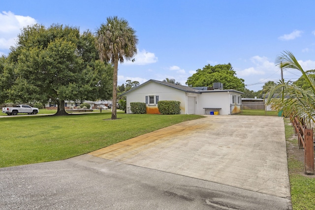 5557 S Shadyside Cir, West Palm Beach, FL 33415 - view of front facade featuring driveway and stucco siding
