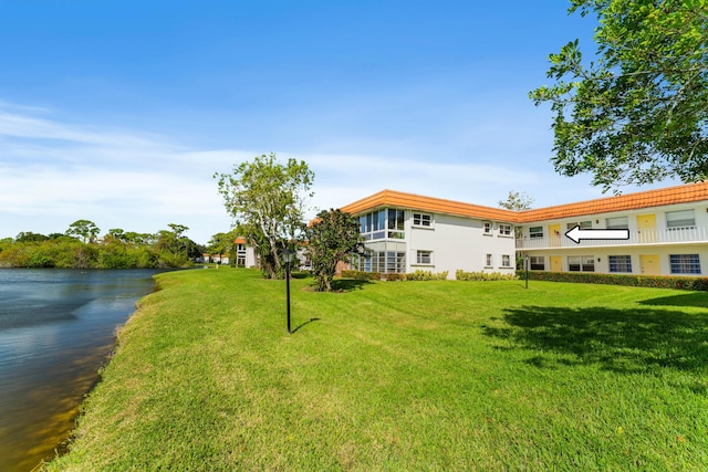 1225 NW 21st St Unit 7-710, Stuart, FL 34994 - view of green lawn with a water view